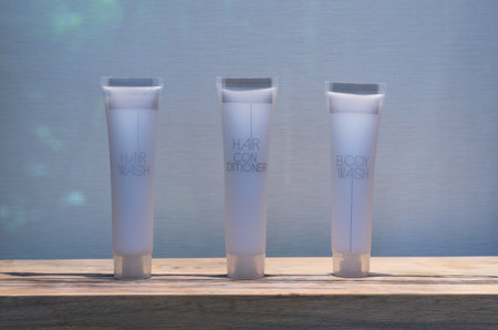 Three Tubes of hair wash , hair conditioner and body wash in bathroomの写真素材