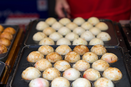 Takoyaki : Meat balls as Japanese style on panの写真素材