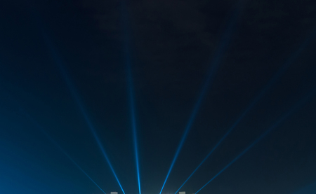 
blue luminous rays on a dark backgroundの写真素材
