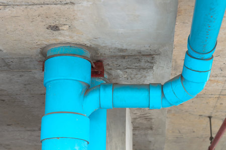 Blue PVC pipe with wall