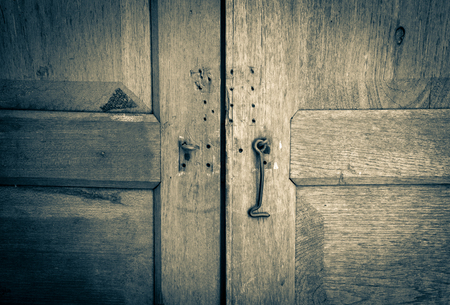 close up wooden doors, vintage traditional old doors with wooden wallの写真素材