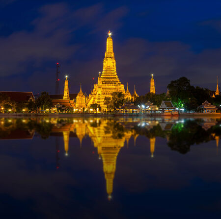 Wat Arun river side with Chao Phraya River in Bangkok at twilight time, Thailandの写真素材