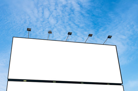 Blank billboard for new advertisement on blue sky