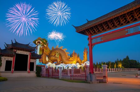 Golden Dragon with fireworks at Suphanburi, Thailand, Public architecture for travelの写真素材