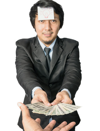 Asian Business giving money with United States Dollars (USD)の写真素材