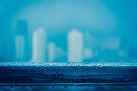 cityscape blur photo with rainsの写真素材