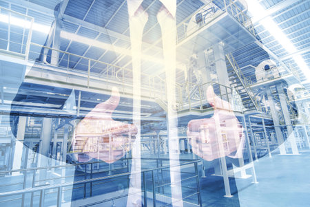 Double exposure of businessman with Industrial equipment Factory