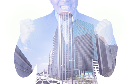Double exposure of businessman with cityscape, Modern glass Business buildingの写真素材