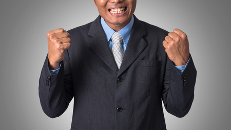Businessman in action cheerful and success, include clipping pathの写真素材