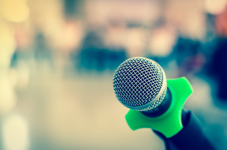 Close up of microphone in conference room on blurred backgroundの写真素材