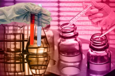 Chemical Laboratory,scientist dropping the reagent into test flaskの写真素材