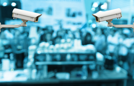 CCTV security camera on monitor the abstract blurred with presentation the coffee on bokeh backgroundの写真素材