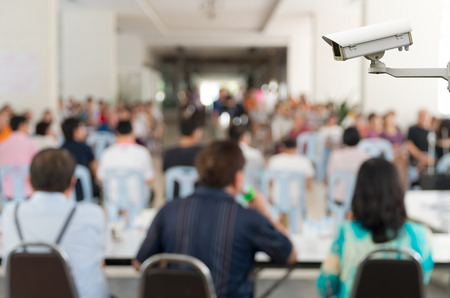 CCTV security camera on monitor the Meeting Blurred background at bright conference hallの写真素材