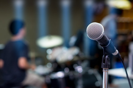 Close up of microphone on musician blurred backgroundの写真素材
