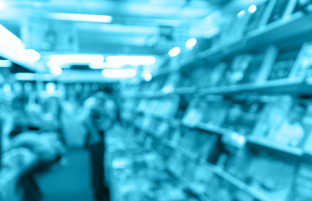 Abstract blurred photo of book store with people background, blur color toneの写真素材