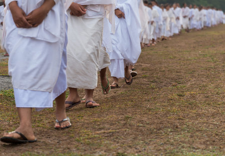 Closeup the foot of Many Buddhist nuns girls line in white suit walking