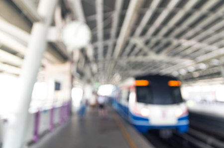 Abstract blurred photo of sky train station with people background