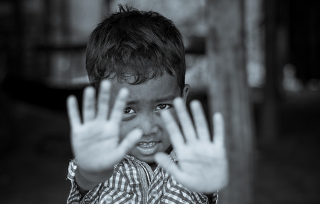 SIEM REAP, CAMBODIA - MAY 2 : Closeup face of Unidentified boy of Cambodian in not permit action at kabal spean on May 2, 2015 in Siem Reap, Cambodiaのeditorial素材