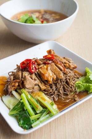 Roasted duck noodles on the tableの写真素材