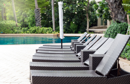 Luxury pool bed beside the swimming poolの写真素材