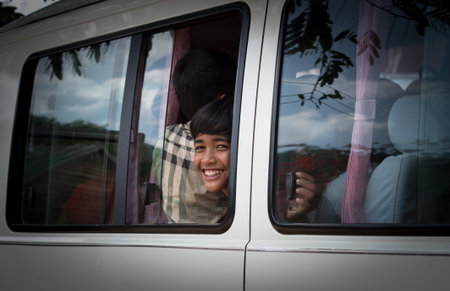 SIEM REAP, CAMBODIA - MAY 2 : Unidentified boys of Cambodian in the van at kabal spean on May 2, 2015 in Siem Reap, Cambodiaの写真素材
