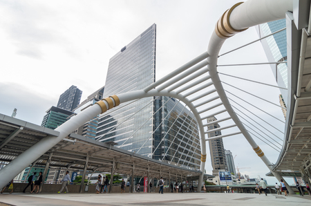 BANGKOK - JUNE 25, 2015: Undefined People are walking on the pedestrian bridge which is Bangkok landmark at Chongnonsi SkyBridge at morning for attendance on June 25, 2015 in Bangkok, Thailand.のeditorial素材