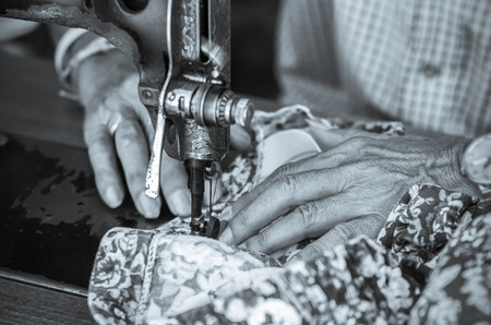 Sewing Process with old man designer handの写真素材