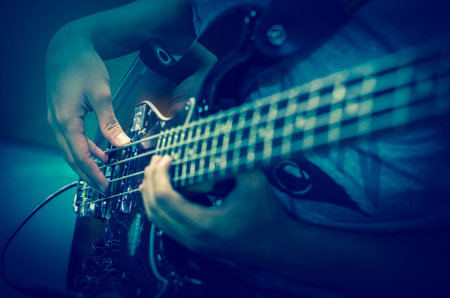 Closeup hands playing guitar