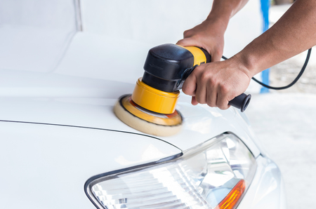 Polishing the white car, car care conceptの写真素材