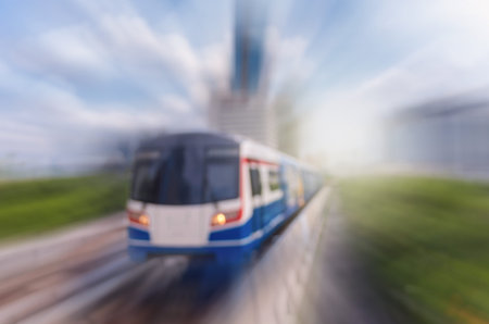 abstract Blurred photo of sky train with traffic and cityscape
