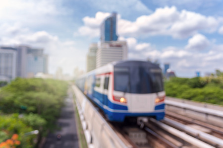 abstract Blurred photo of sky train with traffic and cityscapeの写真素材