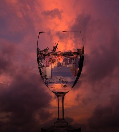 cityscape in glass of wine, abstract photo conceptの写真素材