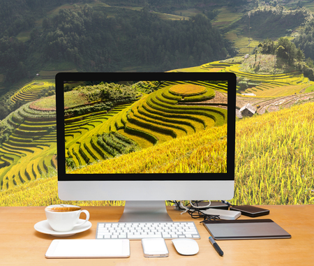 Conceptual image of a workspace with computer desktop on Rice fields on terraced of Mu Cang Chai District, YenBai province, Northwest Vietnamの写真素材