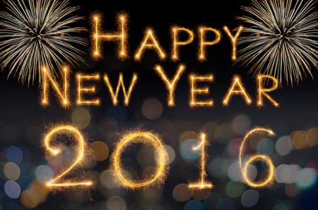 Happy new year 2016 written with Sparkle firework on photo blurred bokeh background
