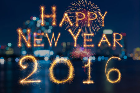 Happy new year 2016 written with Sparkle firework on photo blurred bokeh background