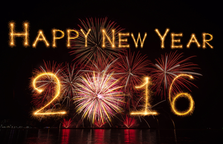 Happy new year 2016 written with Sparkle and firework on black backgroundの写真素材