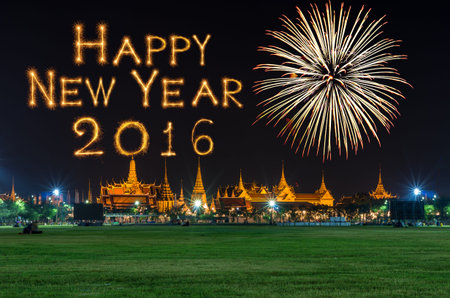 Grand palace at night in Bangkok with Happy new year 2016 written with Sparkle firework, Celebration...