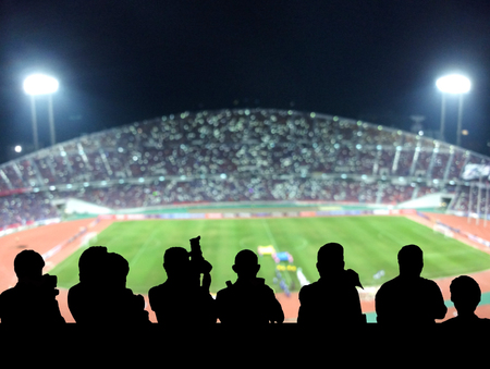 The silhouette of reporter photograph the panorama of Abstract blurred photo of fan sport at stadium, sport background conceptのeditorial素材