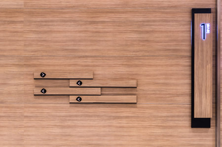 Direction sign on the wooden wall