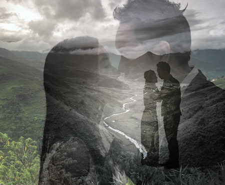 double exposure of loving couple on landscape background, valentine conceptの写真素材