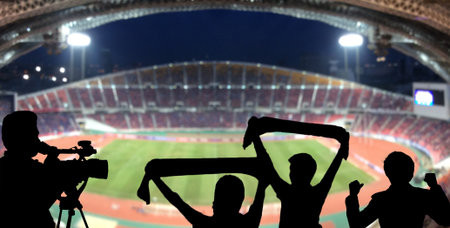 The silhouette of fan club over the panorama of Abstract blurred photo of fan sport at stadium, sport background conceptの写真素材