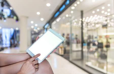 Shopping Online With Digital laptop on Abstract blurred photo with people in department store bokeh, technology and internet conceptの写真素材