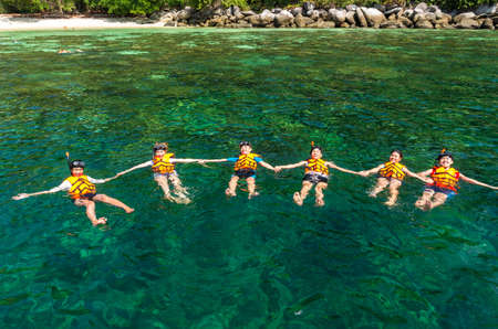 LIPE ISLAND, THAILAND - FEB 20 : undefined Tourists snorkeling with clasp together over the sea around lipe island on february 20, 2016. lipe island located at south of Thailand.のeditorial素材
