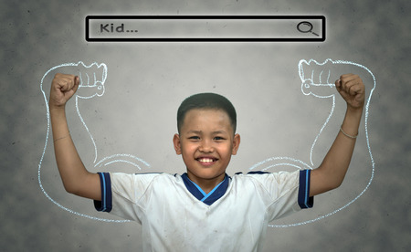 Asian strong boy with browsing of Internet searching bar with "Kid" above the head on the wall background, Health conceptの写真素材