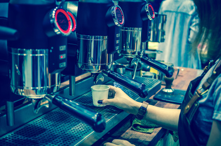 Coffee machine making espresso shot in a cafe shopの写真素材