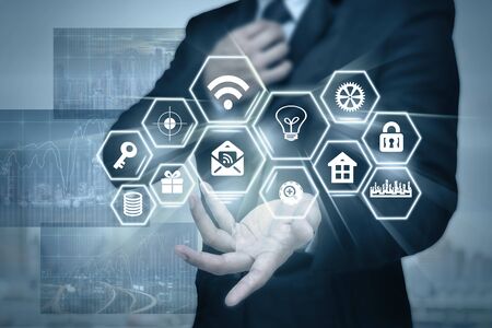 Businessman with show hand posture with the Social media symbol on photo blurred of cityscape...