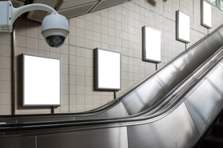 Security camera monitoring on the Blank billboard located in underground hall or subway for advertising, business advertise and security conceptの写真素材