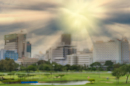 abstract Blurred photo of city with sun background, blur backgrounds conceptの写真素材