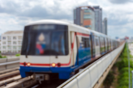 abstract Blurred photo of sky train with traffic and cityscape