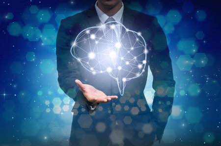 Businessman hand holding the brain over the Abstract Hexagon bokeh background on blue color...